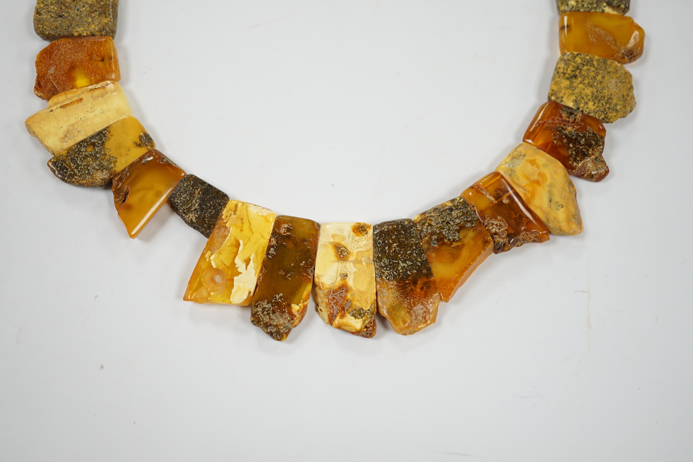 A contemporary Baltic amber fringe necklace, 46cm, gross weight 72 grams.
